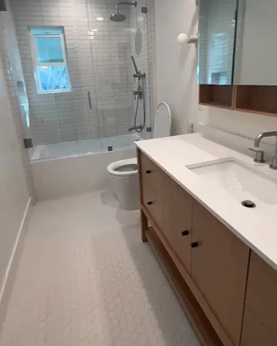 contemporary bath with wood vanity